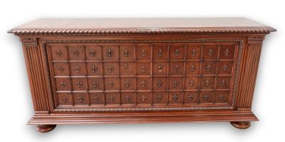 an old wooden chest with many drawers on top of it
