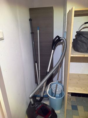 a vacuum that is sitting in the corner of a room