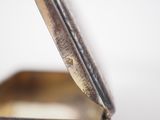 a close up of a metal box with a metal lid