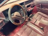 a car with a steering wheel and dashboard in the room