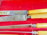 many different types of knives in a red case