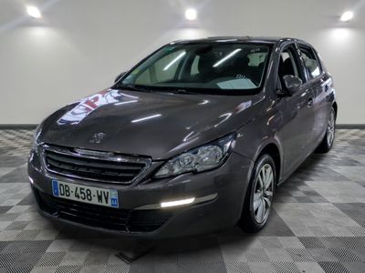 a picture of a grey car parked in a garage
