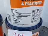 three buckets of paint are stacked on top of each other