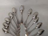 a lot of silver spoons and spoon spoons on the table