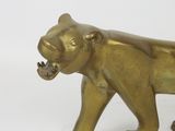 a gold statue of a tiger on a white background