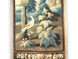 an image of a tapestry hanging on a wall with birds and trees