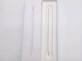a white box with a white pen inside of it