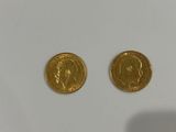 two gold coins, one of which has a face and the other of which is a head