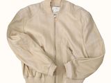 an image of a tan jacket with a zipper on the front