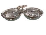 pair of silver plated serving dishes with handles and spoons