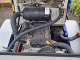 a small engine that is in the back of a truck