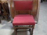 a red chair that is sitting in the middle of a room