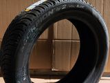 tire on the floor in front of a cardboard box and cardboard boxes
