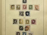 a book with a picture of a woman and a lot of stamps