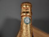 two bottles of champagne that are sitting on a table