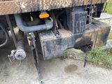 a close up of a rusted truck ' s engine