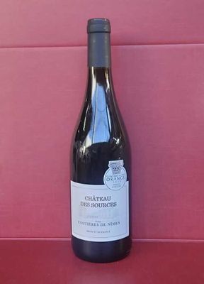 a bottle of wine that is sitting on a table