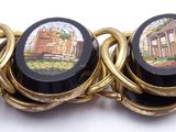 a bracelet that has a picture of a building on it