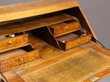 an old wooden desk with a drawer and two drawers