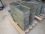many crates stacked up on a pallet in a warehouse