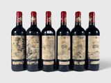 six bottles of wine are lined up in a row