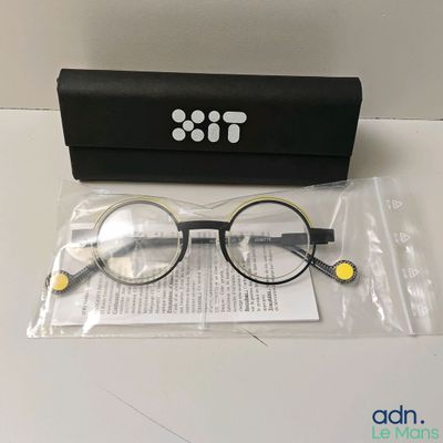 glasses in a black case and a pair of glasses sitting on a table