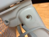 a close up view of a computer screen with a wire attached to it