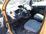 a small yellow car with the door open and the driver ' s seat down