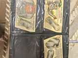 a black wallet with four different pictures on it
