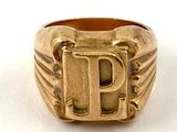 an image of a gold ring with the letter p on it