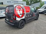 a van that is parked in front of a building