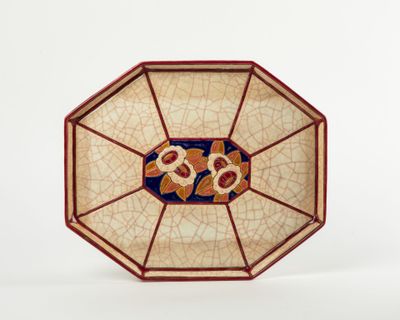 a plate with a design on it on a white surface