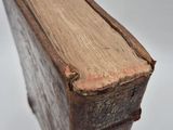 an old book that is sitting on a table