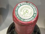a bottle of wine that is sitting on a table