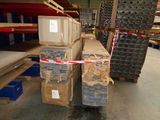 several stacks of boxes are stacked on top of each other in a warehouse
