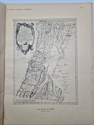 an open book with a drawing of a map on it