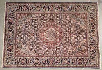 an antique persian rug with a medallion design on a white background