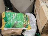 a pile of garbage in the corner of a room