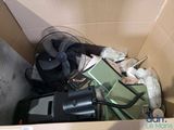 a box full of assorted items and a fan