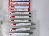 a lot of pens that are sitting on a table