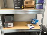 many boxes and boxes on a shelf in a room