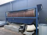an image of a machine that is outside of a building