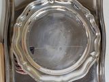 a silver tray with a silver plate on top of it