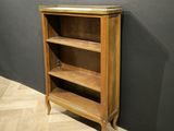 an image of a wooden bookcase with two shelves on top of it