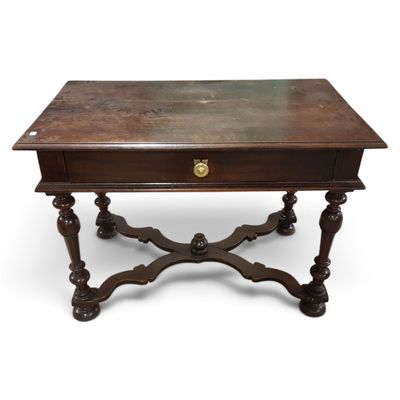 an old wooden table with a drawer on top of it