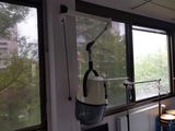 a hospital room with a hospital bed and a window with a view of the city