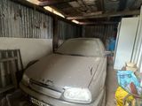 a dirty car that is parked in a garage