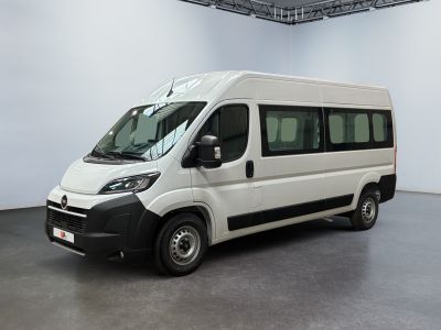 a picture of a white van parked in a large room