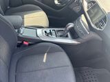 the interior of a small car with black seats and dashboard