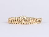 un bracelet en or jaune au motif tressé